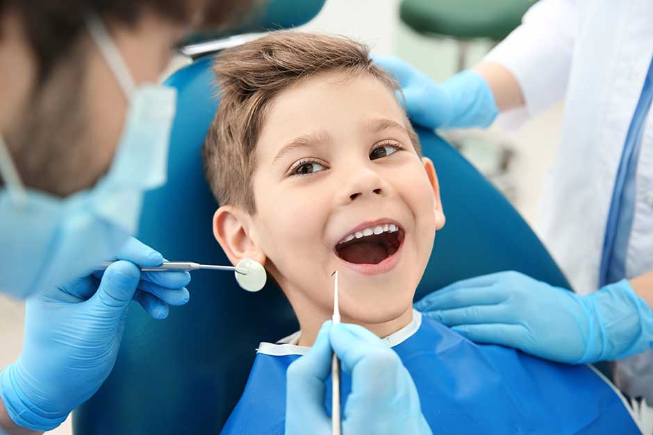 A young boy getting a dental checkup.